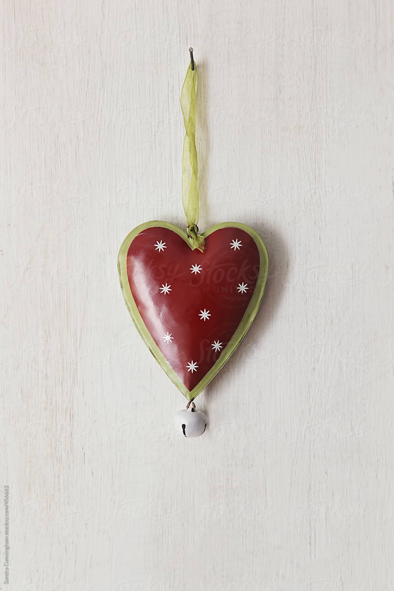 Tin heart hanging on wood