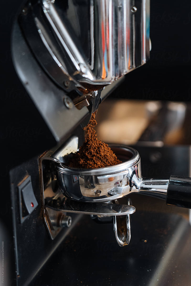 Coffee grinder milling black coffee