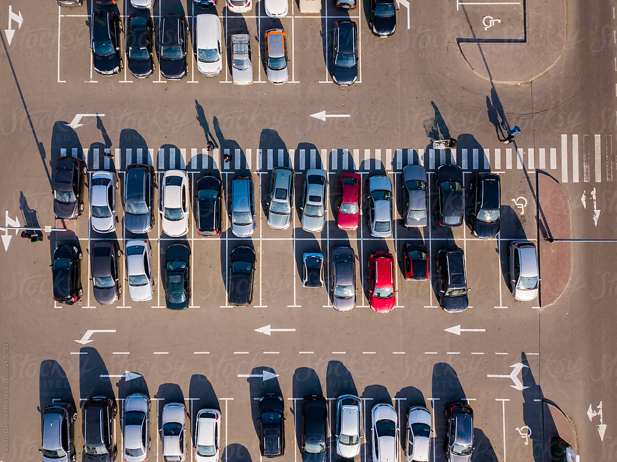 Top aerial view parking with road marking, colored cars
