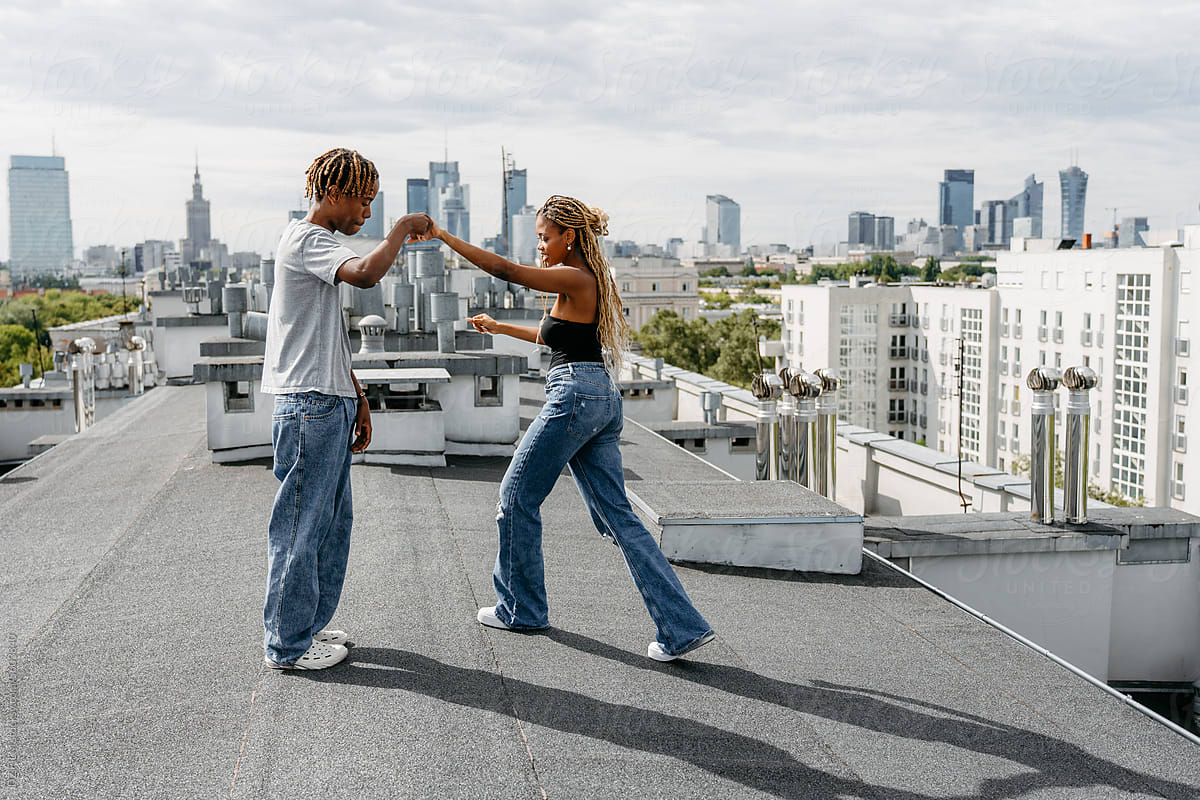 Man and woman dancing on the roof