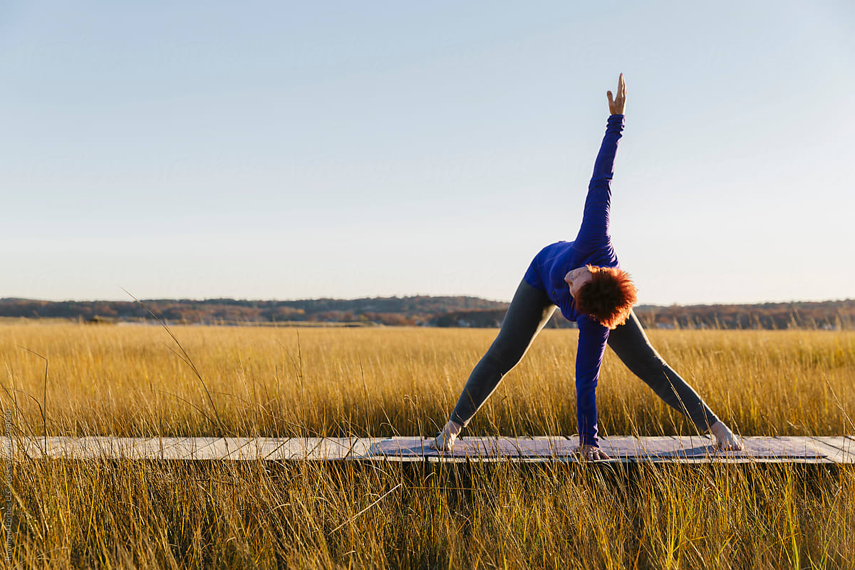 Yoga Exercise with Senior Citizen woman outdoors