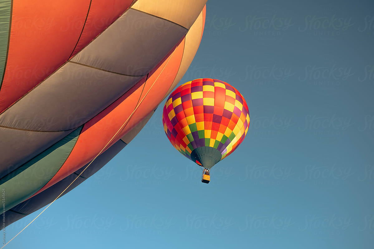 Hot Air Balloon Among Bright Blue Sky