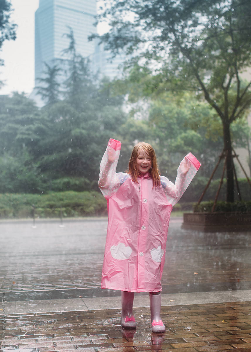Little Girl playing in the rain