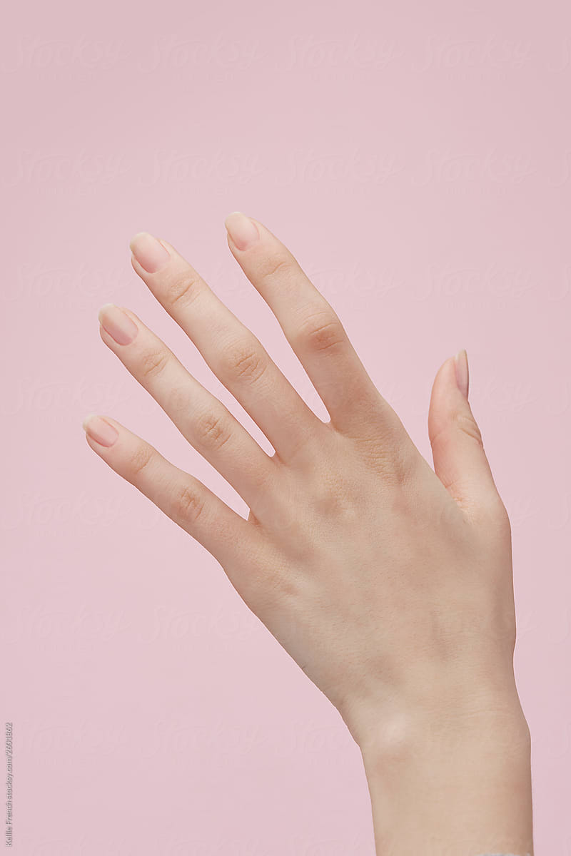 Hand against pink background
