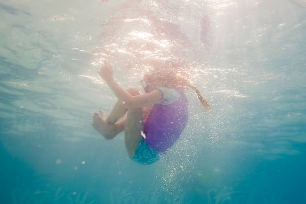 Boy Diving Deep Swimming Underwater With Vintage Dive Facemask by Stocksy  Contributor JP Danko - Stocksy
