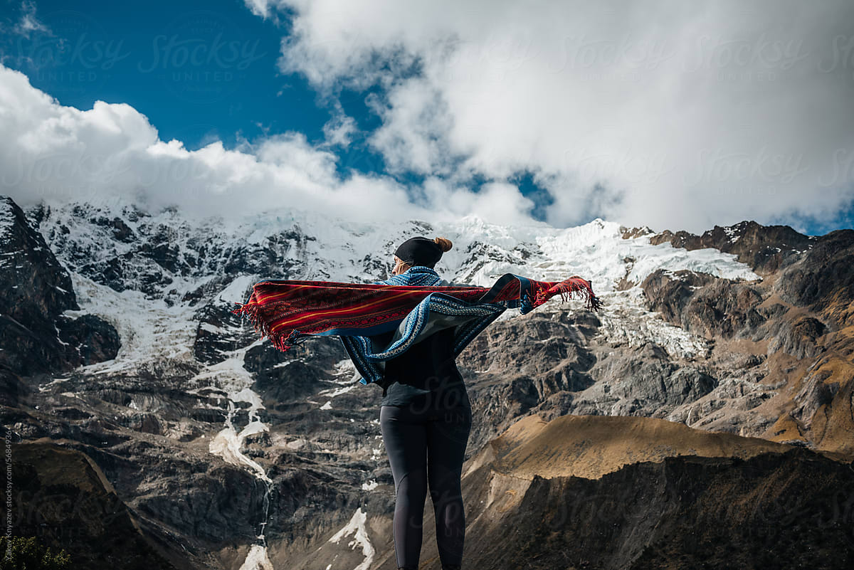 Woman Standing In The Wind, on a high  Mountain
