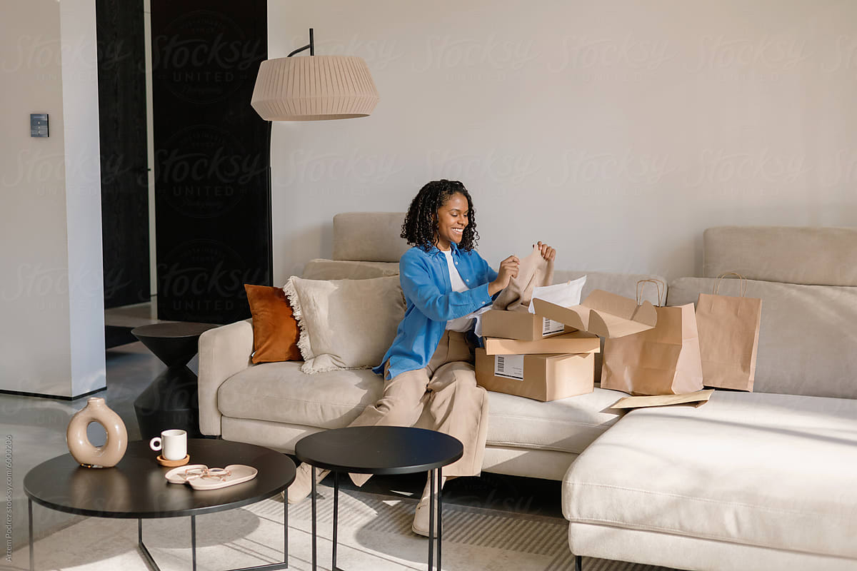 Woman Unboxing New Purchase at cozy home