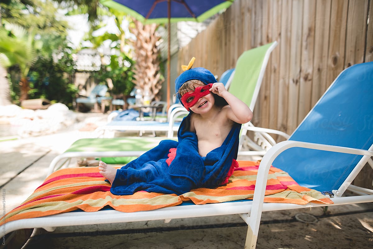 Superhero Lounges At The Pool By Courtney Rust