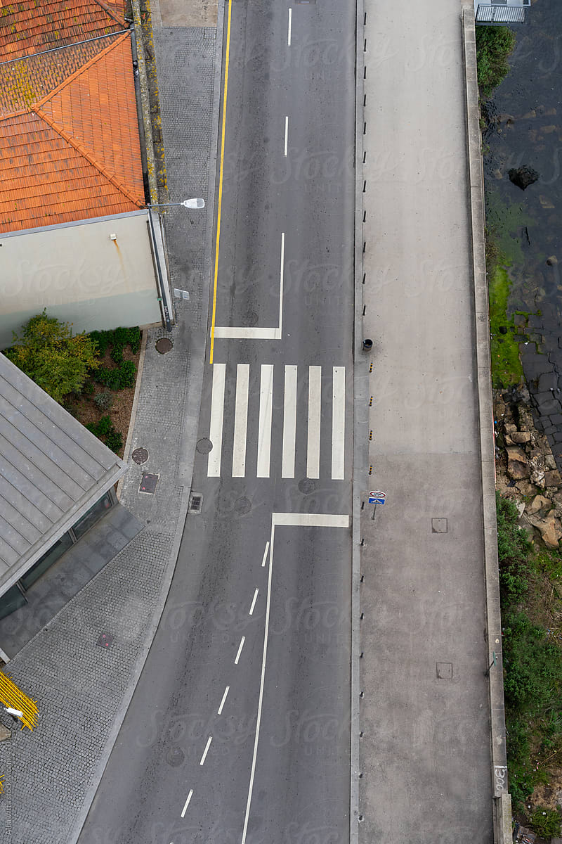 Aerial view of road with zebra crossing in city