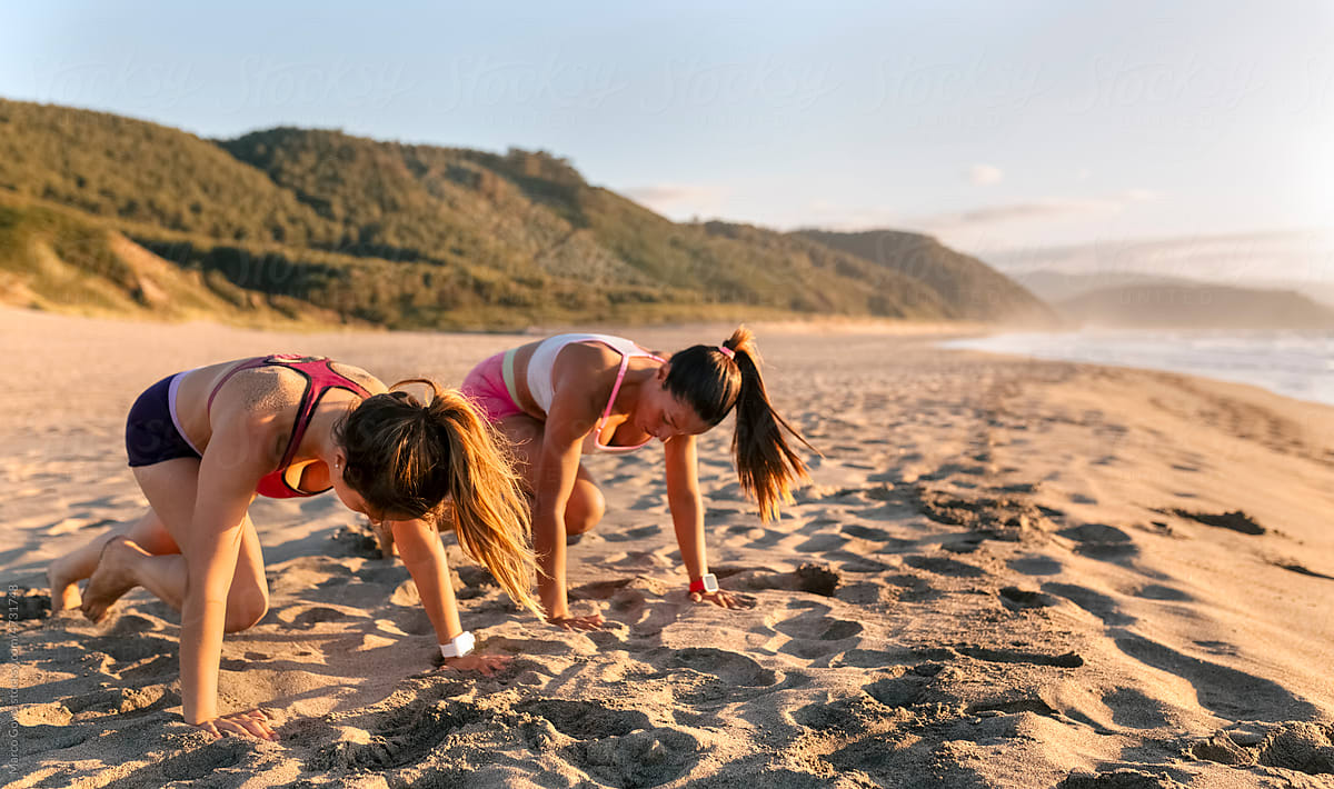 Two women training on the beach