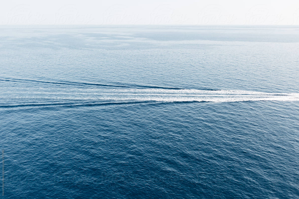 Waves from a boat in the middle of the sea