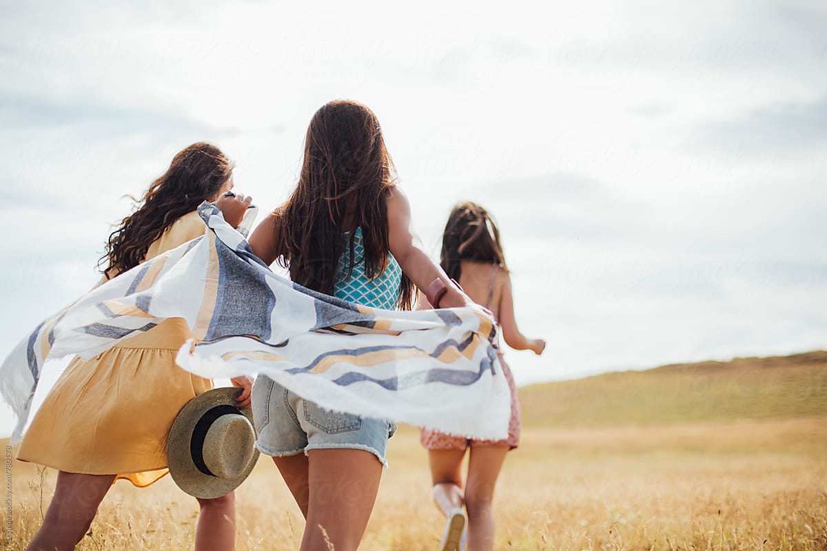 Three Girls Running in a Field by 