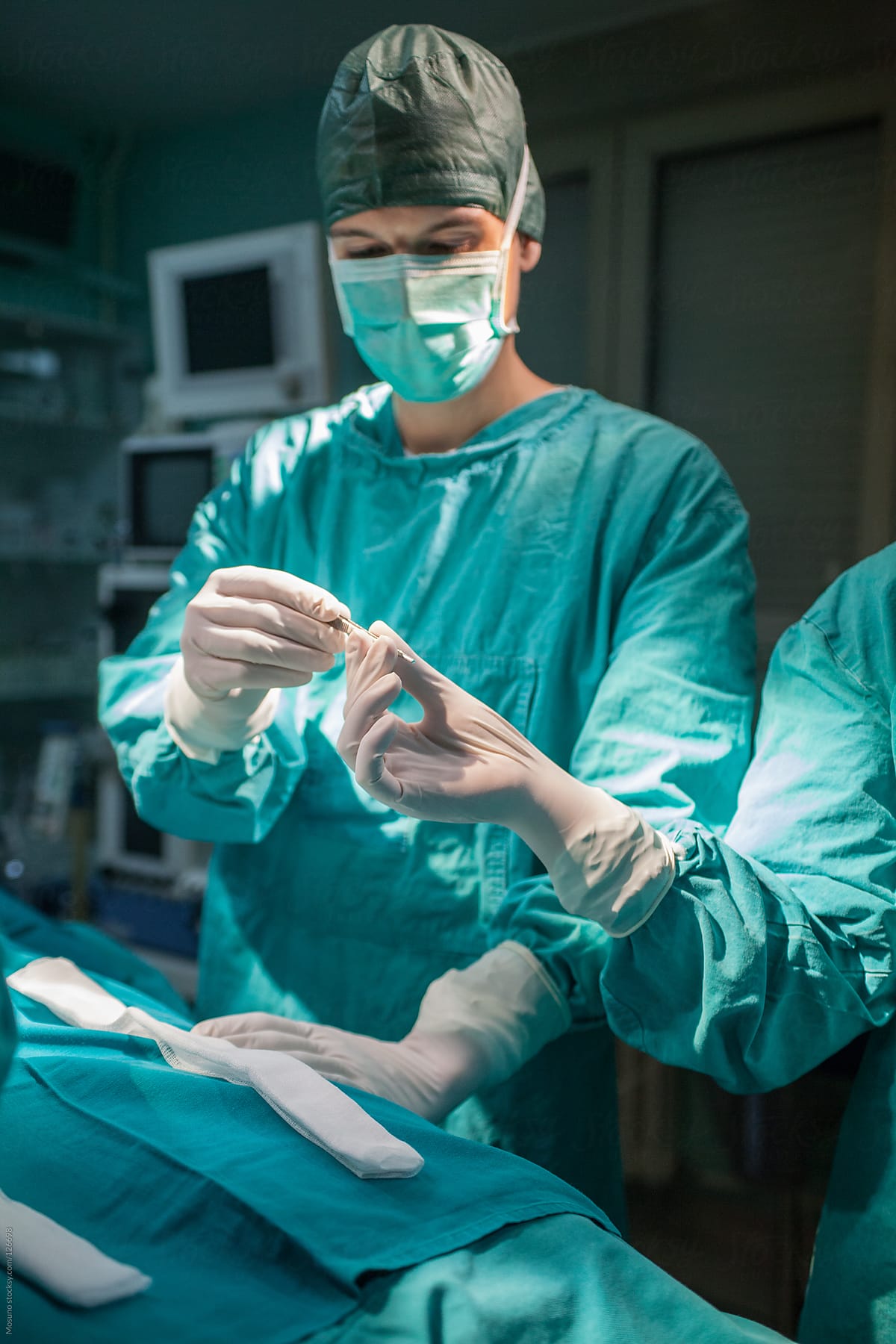 Surgeon and His Assistant in the OR
