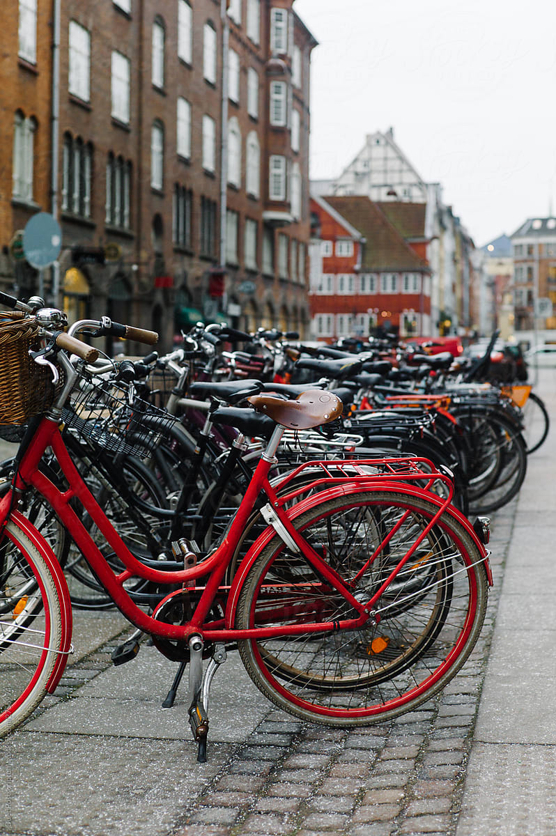 Bikes at the parking area near historical buildings. Copenhagen, Denmark.