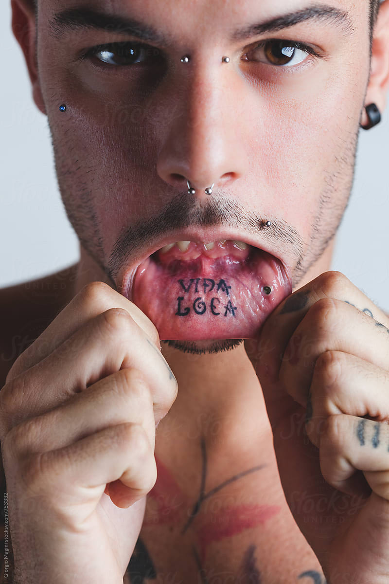 Vida Loca Tattoo Inside the Mouth Lips of a Young Man