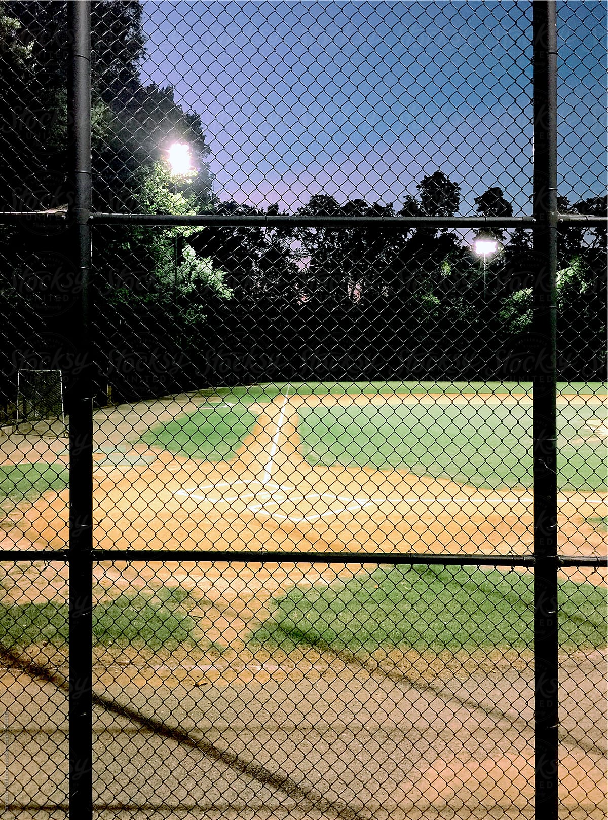 Empty baseball diamond at night