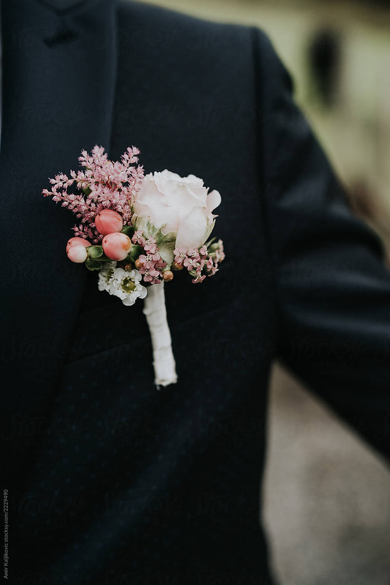 Pink and white floral corsage on a lapel