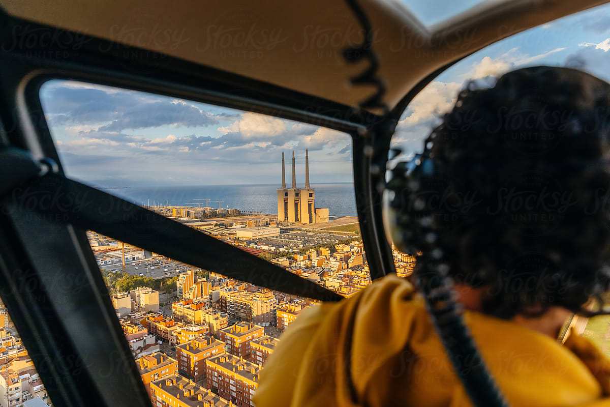 Passenger inside a helicopter  flying over the city
