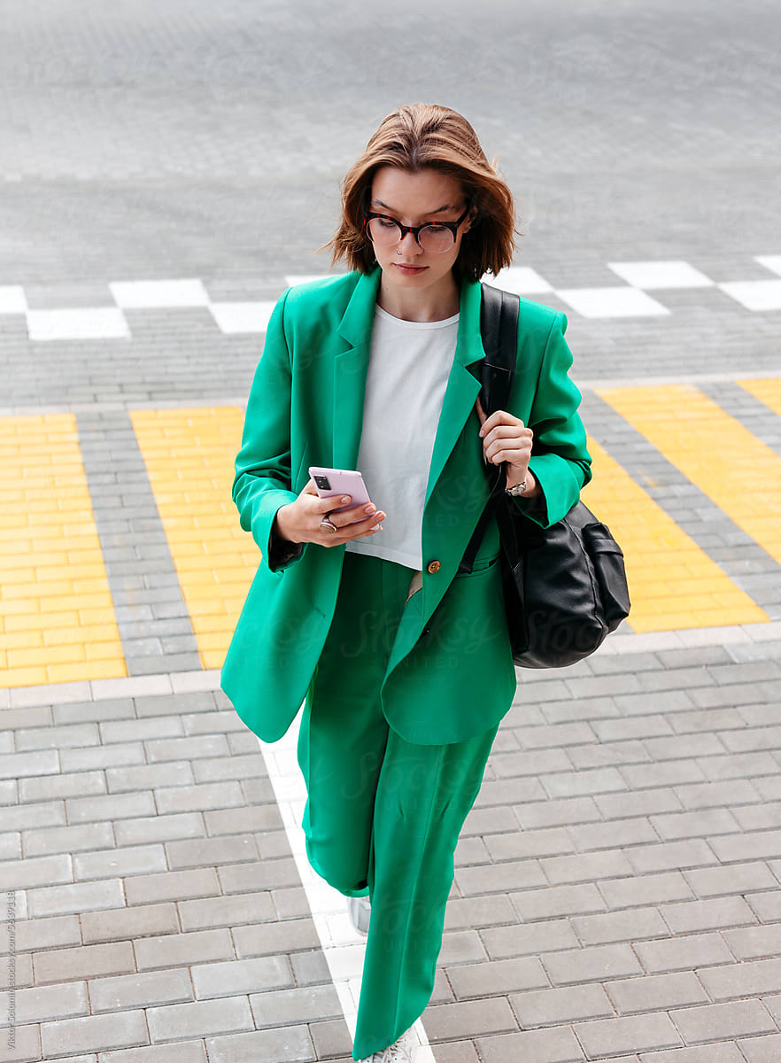 Stylish woman with smartphone on street