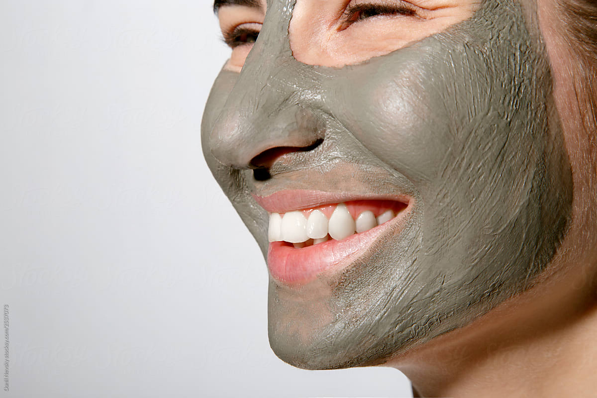 Smiling female with facial mask on