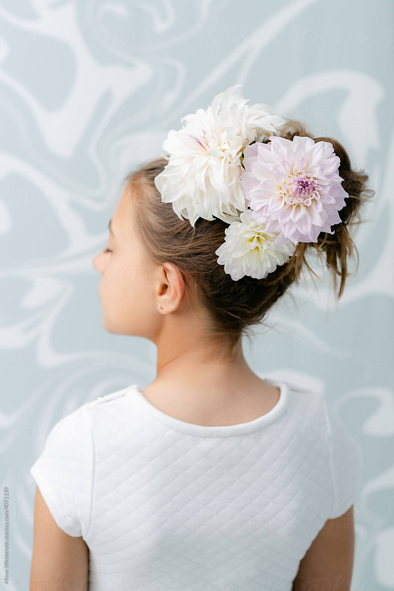Child has flowers in her hair