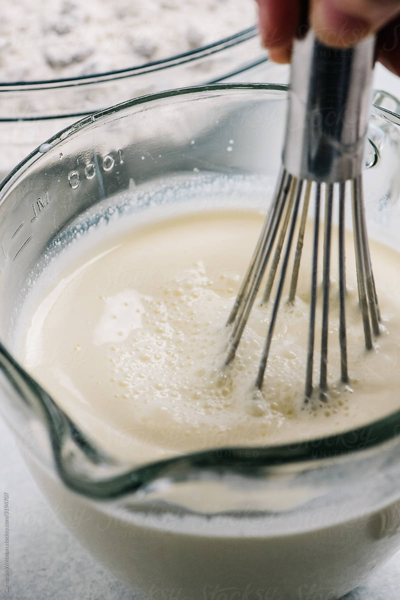 Whisking a milk wet mix for making bread