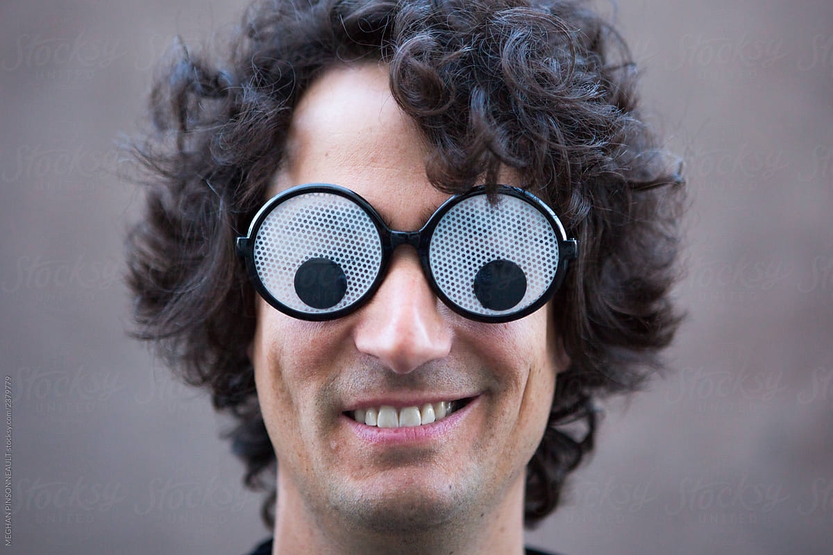 Man Wearing Big Googly Eye Glasses by Stocksy Contributor MEGHAN