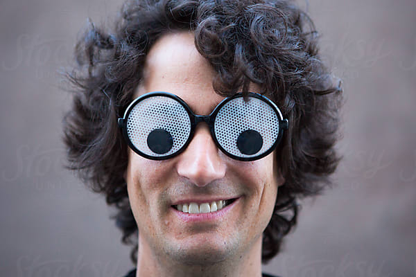 Man Wearing Suit Covered In Googly Eyes by Stocksy Contributor