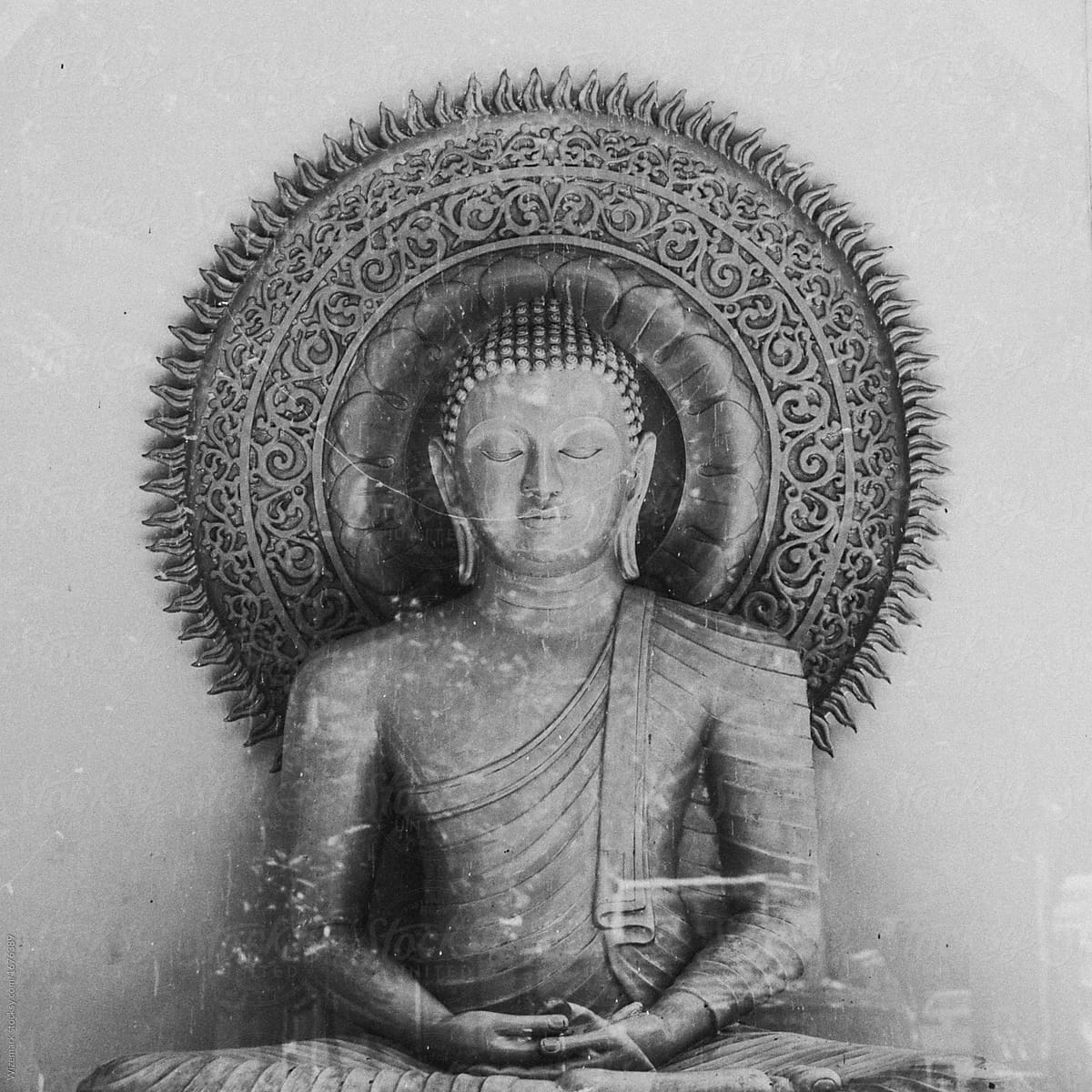 black and white, monochrome sitting Buddha sculpture