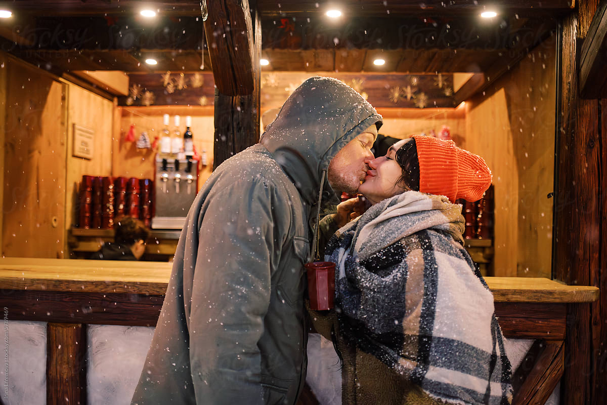 Couple\'s Sweet Moment by the Mulled Wine Booth