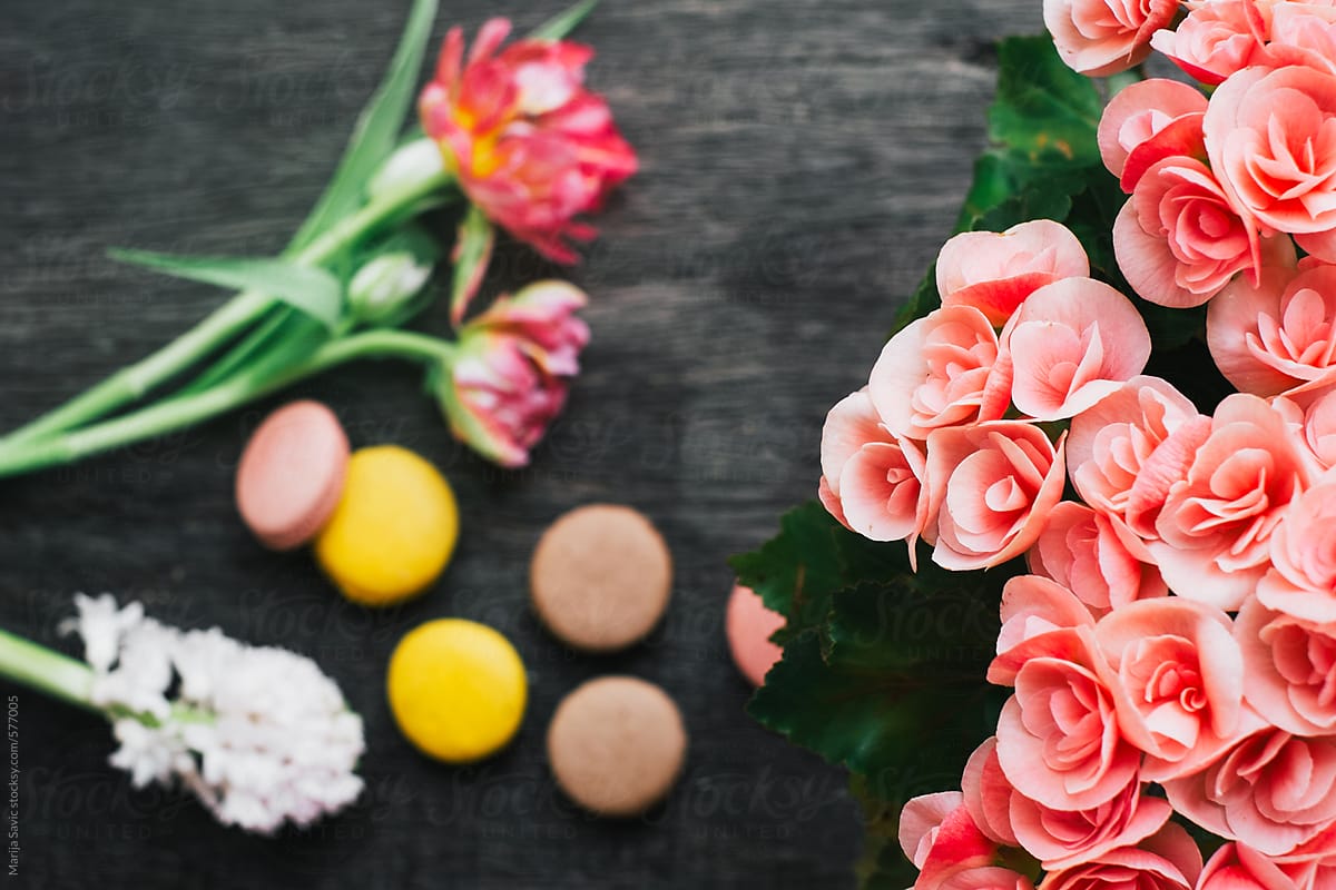 Flowers and Cookies on Dark Wooden Background