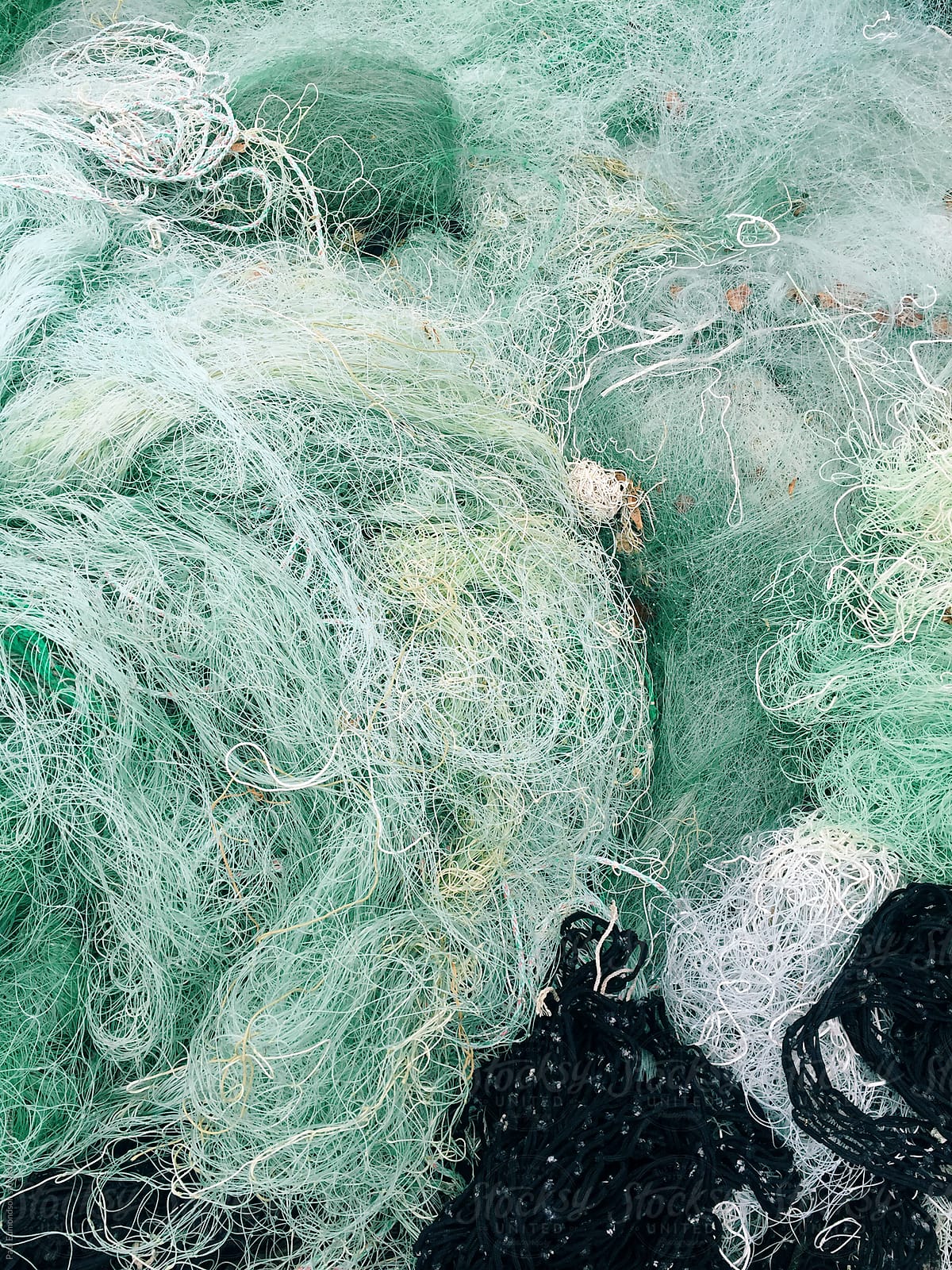 Close Of Commercial Fishing Nets by Stocksy Contributor Rialto