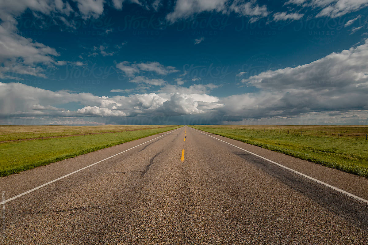 A road cuts across the prairies.