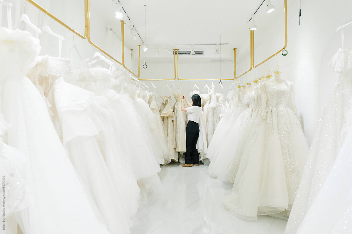 Young woman in wedding dress shop