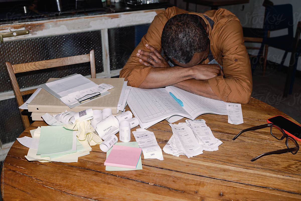 Exhausted Business Owner Amidst Bookkeeping