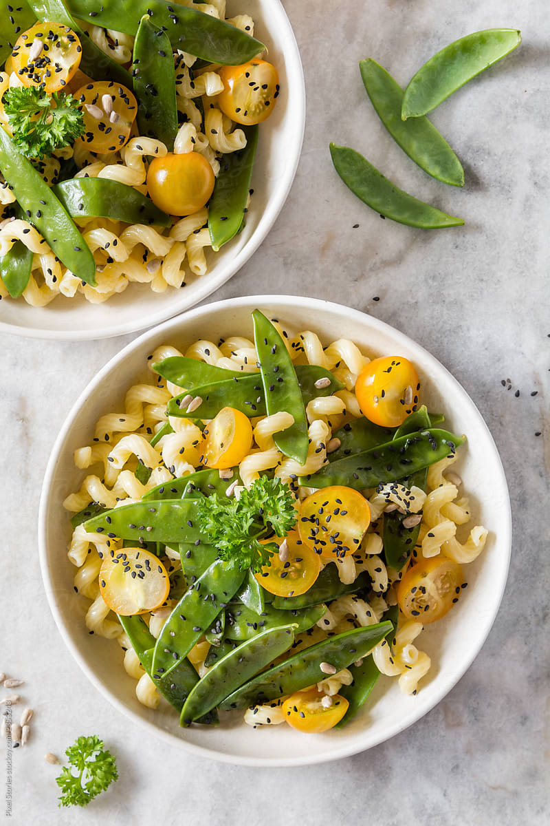 Simple snow pea, cherry tomatoes and pasta salad