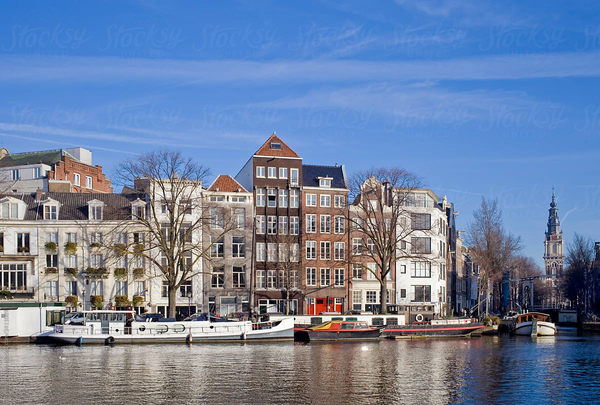 amstel river in amsterdam with buildings