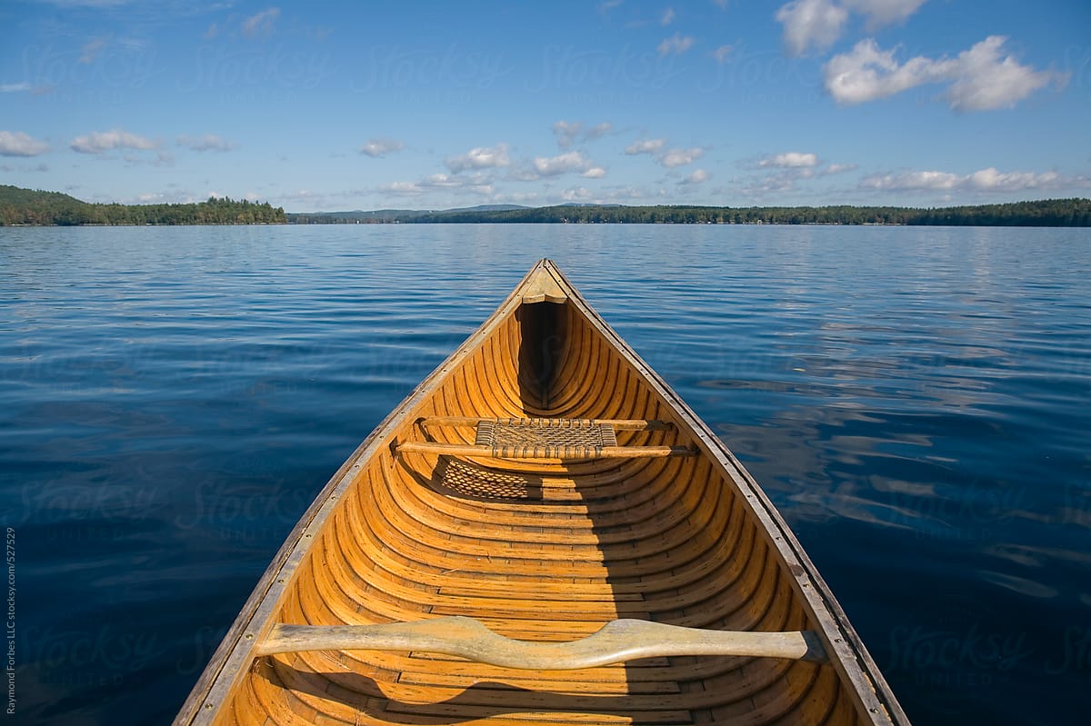Landscape of Wooden Canoe on Lake in Maine in summer