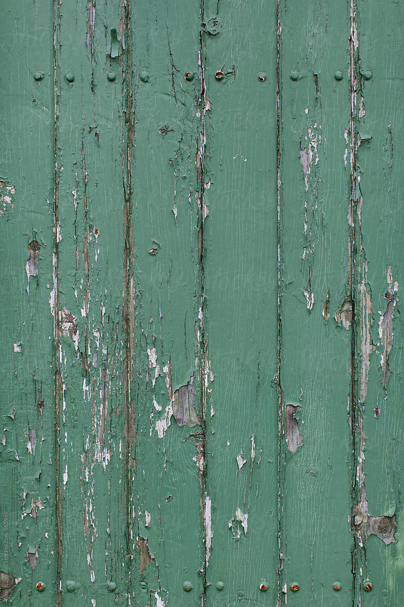 Old wood texture with peeling green paint