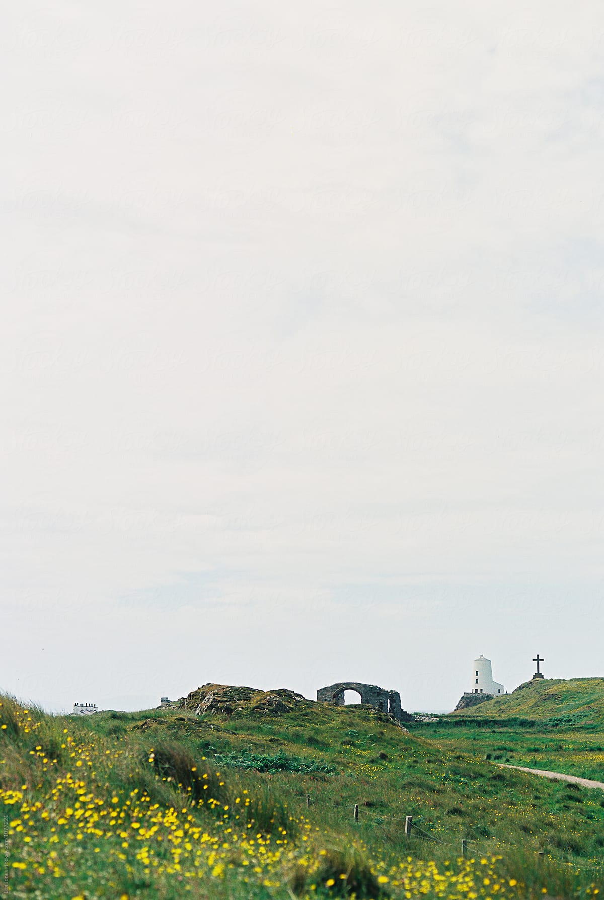lighthouse and cross on island