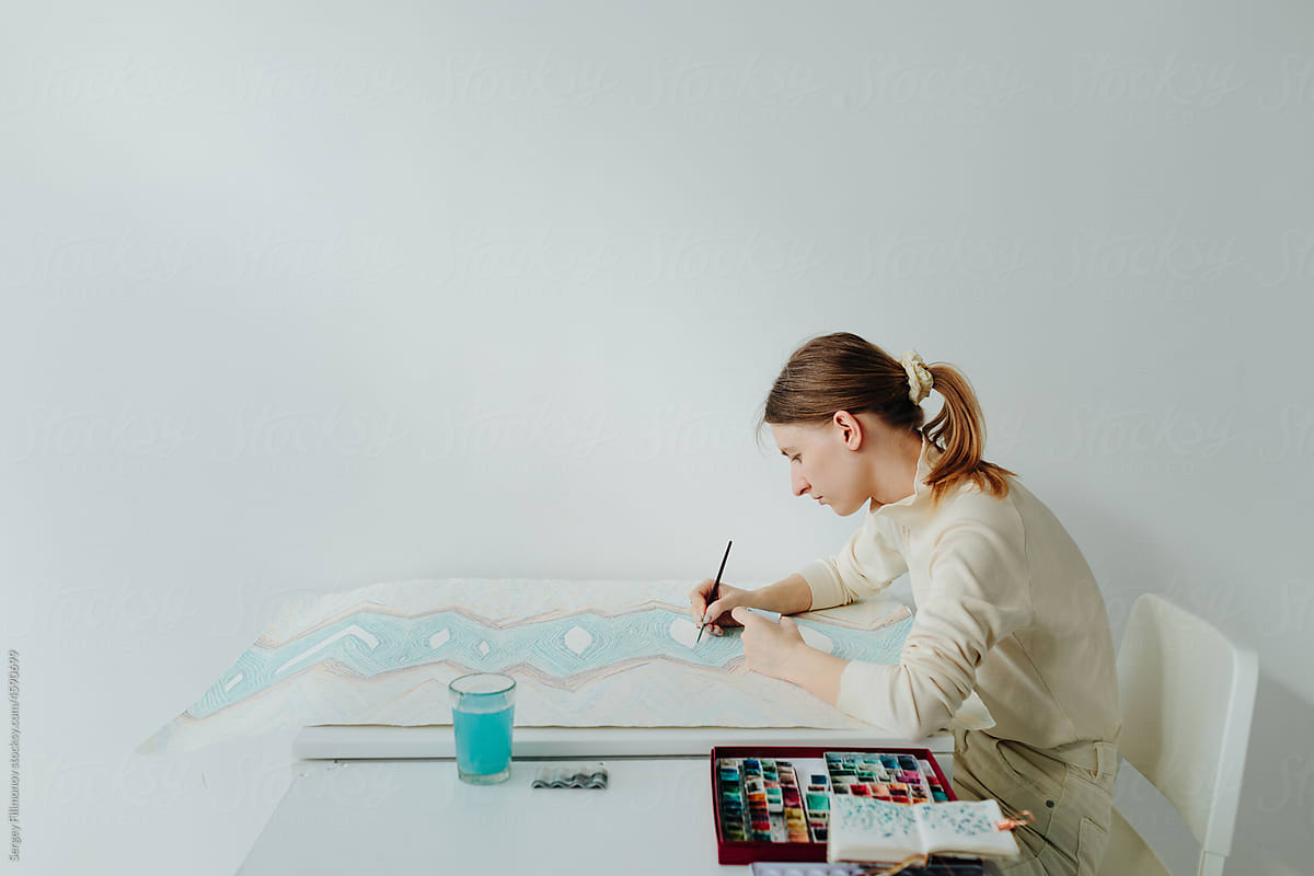 Creative woman artist working in art studio