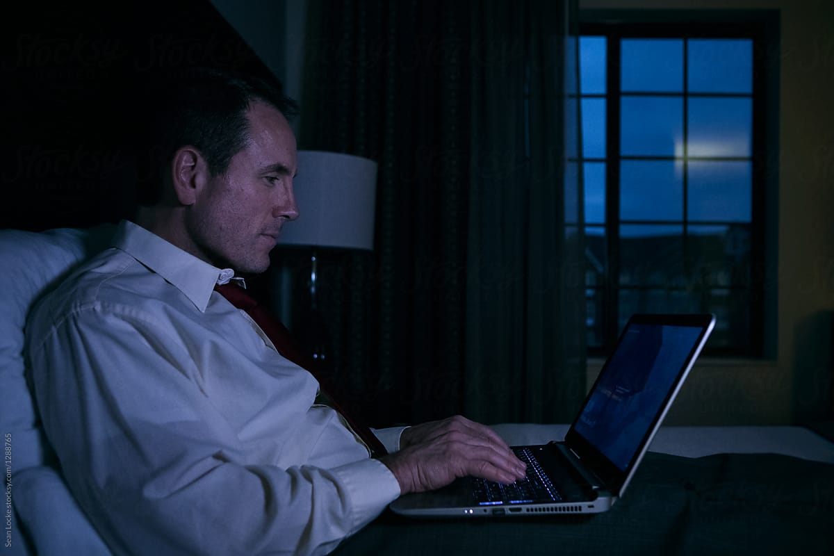 Business: Man Works On Laptop Into The Night