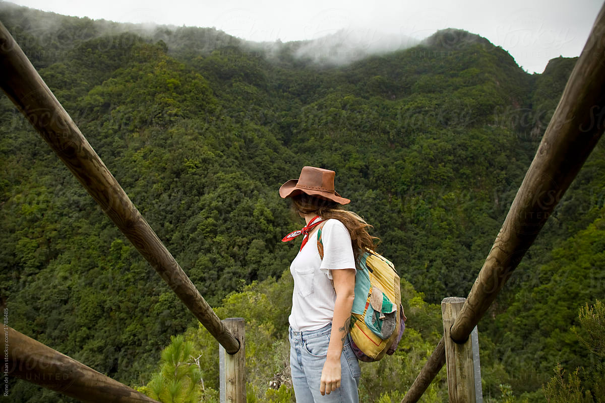 young woman at viewpoint at rainforest