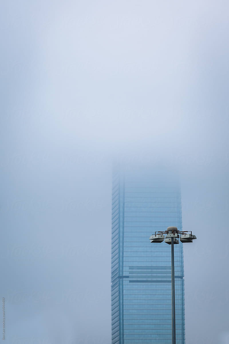 The International Commerce Centre hidden in low clouds