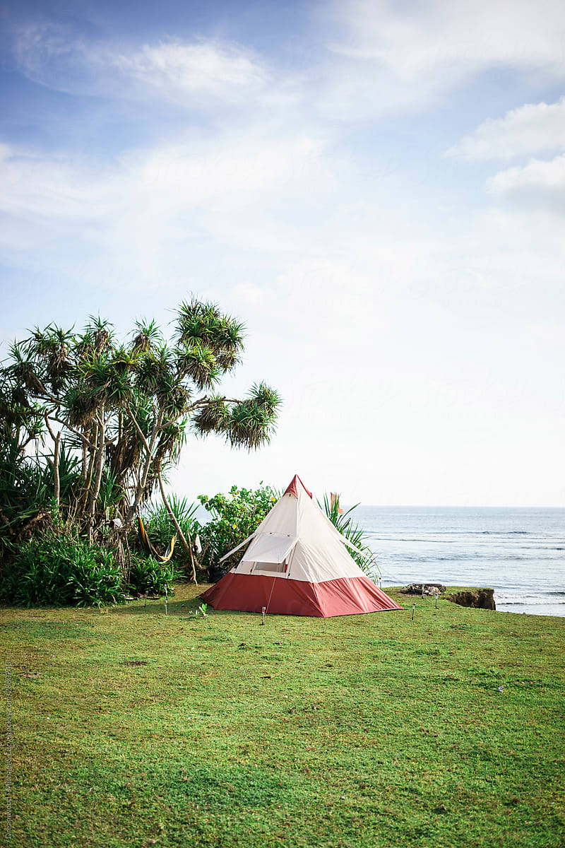 Tent on tropical shore near sea