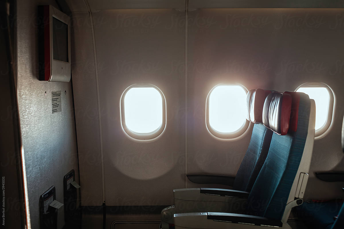 two empty seats in airplane during flight, aircraft interior