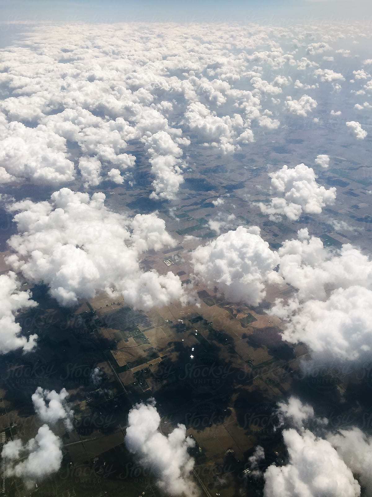 Cloud formations viewed above from airplane window