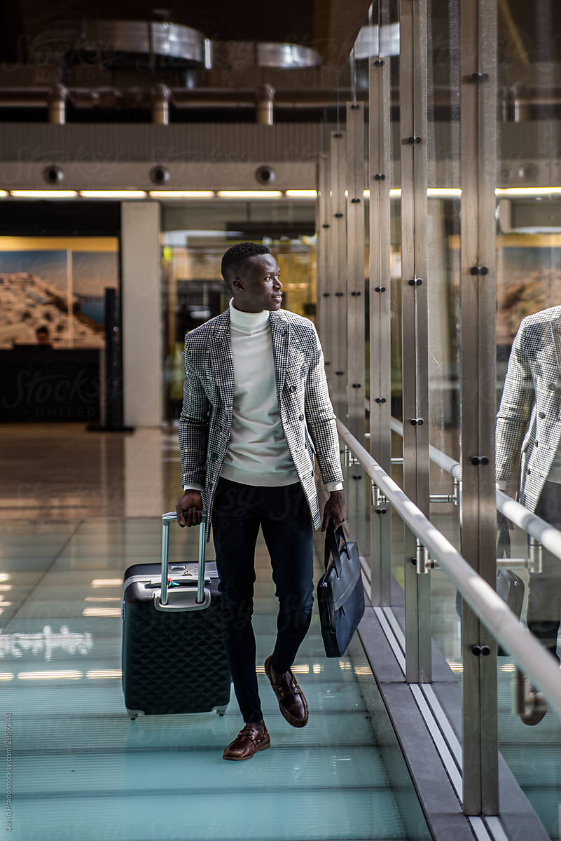 young businessman walking at the airport terminal