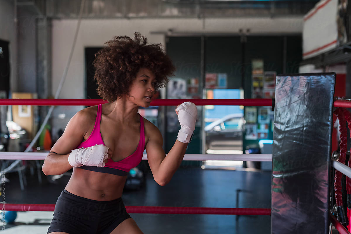 Black woman boxer in action