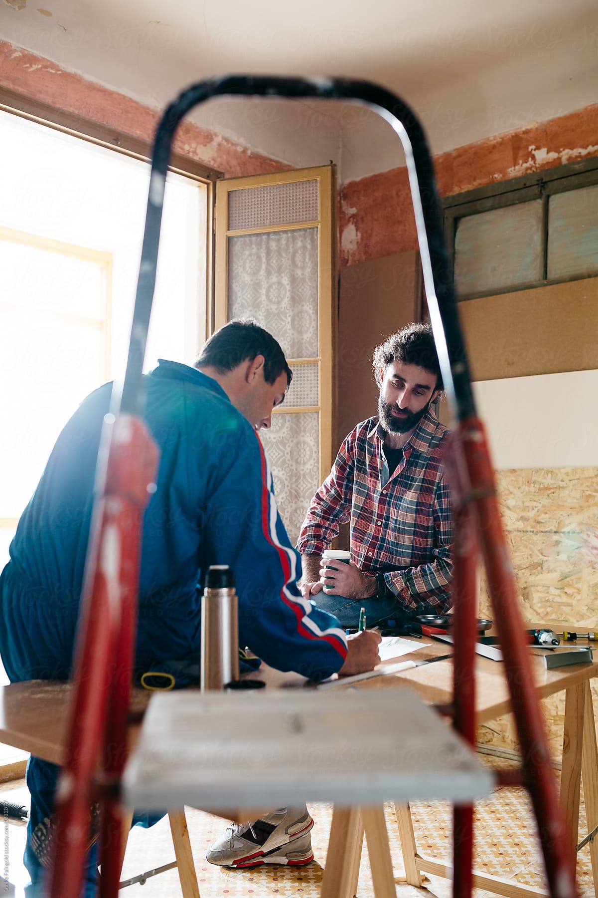 Men in workshop.